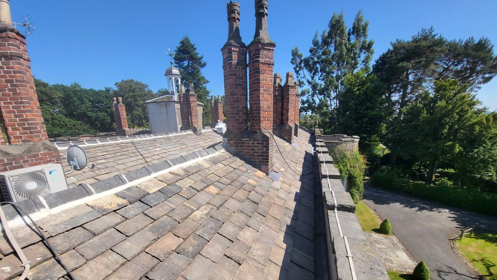 Commercial re-roofing project. Full roof restoration to stone roof at Bonis Hall.