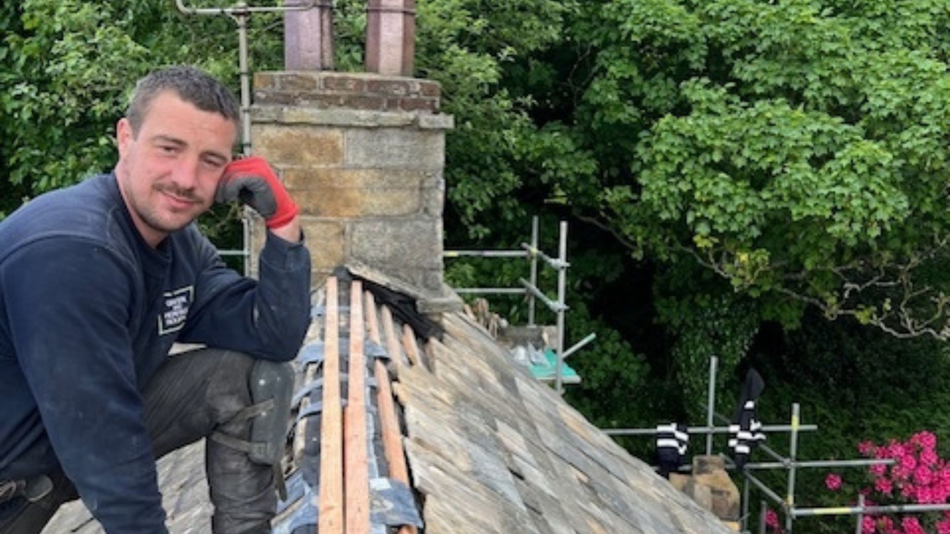 Adam posing whilst carrying out a roof replacement to a heritage property.